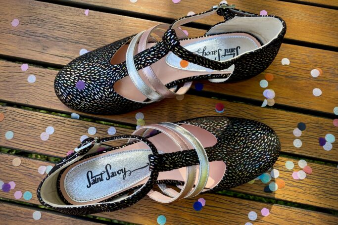 Black with colorful confetti freckles, pink and silver straps, leather sole, leather heel, leather upper